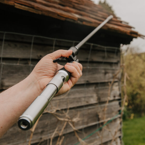 Close up of hand squeezing trigger on Kerminator® Wasp Lance
